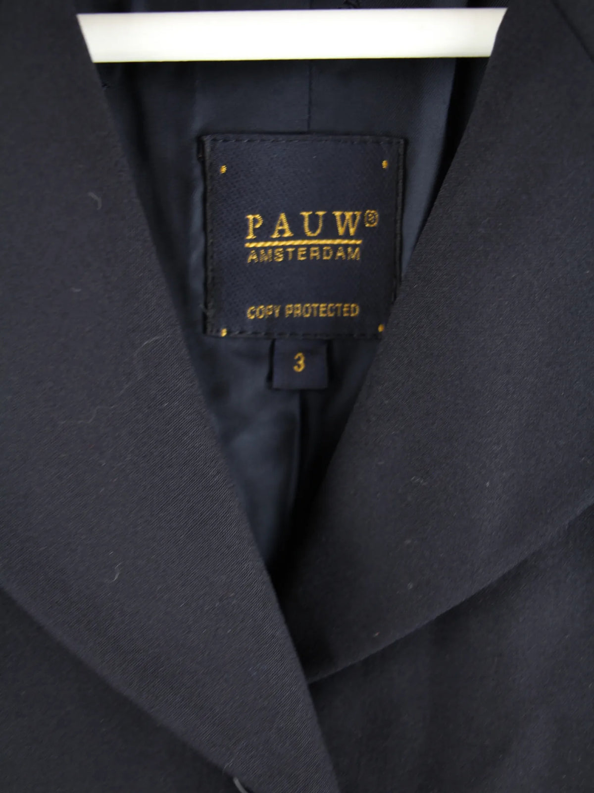 Pauw Mantel Schwarz L – Etikett
